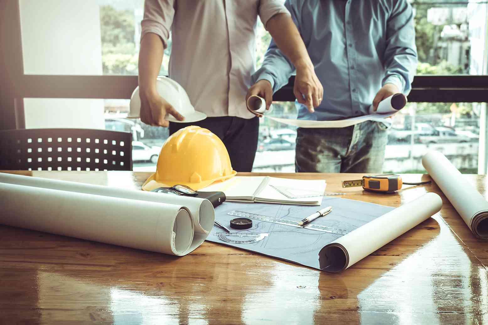 Contractors reviewing house plans
